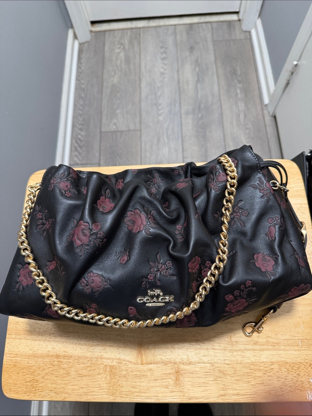 COACH Black Leather Shoulder Bag with Burgundy Floral Print and Gold Chain Faye